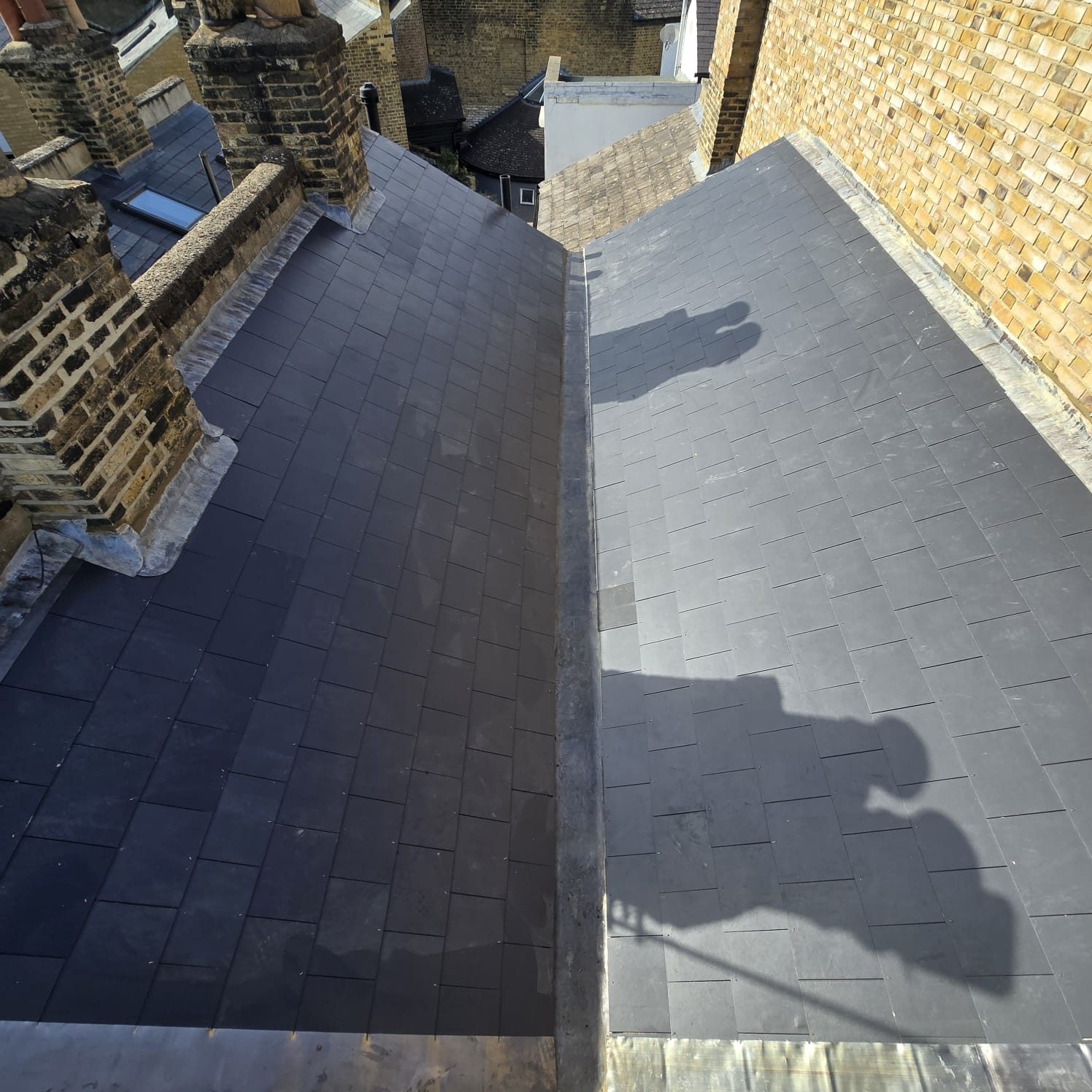 Completed slate roof by Trend Roofing and Construction